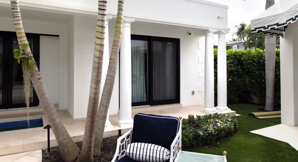 A technician working on a server rack in a partially constructed space.