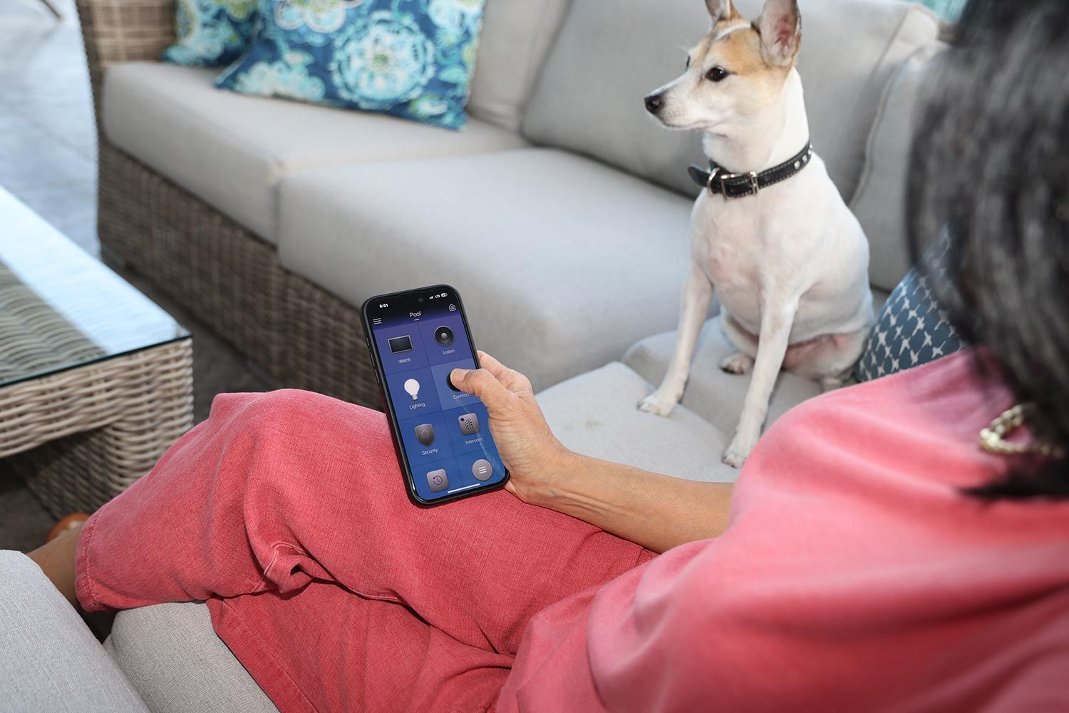 A smart home wall setup featuring a thermostat, a control tablet, and switches.